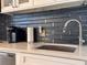 Modern kitchen featuring stylish backsplash, quartz counters and stainless steel appliances at 935 S Atlantic Ave # 244, Daytona Beach, FL 32118