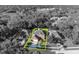 The property's boundary is outlined in yellow, highlighting its position in a charming neighborhood with lush trees at 9455 Belmont Ter, Oviedo, FL 32765