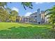 Lush backyard with screened-in pool area, perfect for outdoor enjoyment and entertaining at 9455 Belmont Ter, Oviedo, FL 32765
