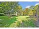 Expansive backyard with mature trees, providing ample shade and a park-like setting at 9455 Belmont Ter, Oviedo, FL 32765