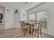 This bright dining room features a wooden table and lots of natural light at 9455 Belmont Ter, Oviedo, FL 32765