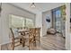 The dining room features a wood table and chairs, with natural light from the large window at 9455 Belmont Ter, Oviedo, FL 32765