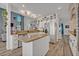Open-concept kitchen with granite countertops, an island, stainless steel appliances, and plenty of light at 9455 Belmont Ter, Oviedo, FL 32765
