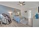 The spacious main bedroom features neutral walls, ceiling fan, and sitting area at 9455 Belmont Ter, Oviedo, FL 32765