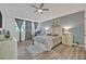 The main bedroom features neutral decor, large windows, and a ceiling fan at 9455 Belmont Ter, Oviedo, FL 32765