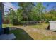 Large backyard with grass and chain link fence at 1002 S Locust Ave, Sanford, FL 32771