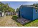 Back of home with storage shed, new fence and access to rear entry at 1002 S Locust Ave, Sanford, FL 32771