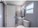 Chic bathroom with a modern vanity, mirror, and fixtures at 1002 S Locust Ave, Sanford, FL 32771