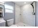 Modern bathroom featuring a tiled shower and updated fixtures at 1002 S Locust Ave, Sanford, FL 32771