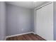 This bedroom offers neutral walls, trim, and wood flooring at 1002 S Locust Ave, Sanford, FL 32771