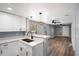 Bright kitchen with breakfast bar opens to a spacious living area at 1002 S Locust Ave, Sanford, FL 32771