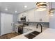 Bright kitchen features stainless appliances, modern cabinetry, and a sleek sink at 1002 S Locust Ave, Sanford, FL 32771