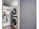 Laundry area with modern washer/dryer located adjacent to a fully remodeled bathroom at 1002 S Locust Ave, Sanford, FL 32771