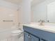 Bathroom featuring a bathtub, single sink vanity, and updated fixtures at 106 Water Oak Dr, Sanford, FL 32773