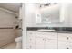 This bathroom features a tiled shower, a large vanity, and updated fixtures at 106 Water Oak Dr, Sanford, FL 32773