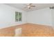 Spacious bedroom featuring parquet floors and a window letting in natural light at 106 Water Oak Dr, Sanford, FL 32773