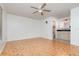 This main bedroom features parquet floors, ceiling fan, and attached bathroom at 106 Water Oak Dr, Sanford, FL 32773