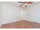 This bedroom features wood floors, a ceiling fan, and a large closet at 106 Water Oak Dr, Sanford, FL 32773