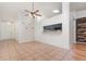 This dining room features neutral tile floors, decorative hooks, and a pass-through window to the kitchen at 106 Water Oak Dr, Sanford, FL 32773