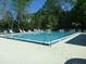 Community pool with lounge chairs and umbrellas at 106 Water Oak Dr, Sanford, FL 32773