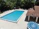 Beautiful community swimming pool with ample seating and shade for relaxing poolside at 106 Water Oak Dr, Sanford, FL 32773