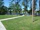 Picturesque waterfront picnic area with lush green lawns and picnic tables by the water's edge at 106 Water Oak Dr, Sanford, FL 32773
