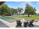 Stunning backyard featuring a pool, waterfront view and comfortable seating area at 1112 Preserve Point Dr, Winter Park, FL 32789
