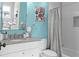 Well-lit bathroom features granite countertop and shower with curtain at 1112 Preserve Point Dr, Winter Park, FL 32789
