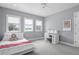 Cozy bedroom with study area features natural light and neutral decor at 1112 Preserve Point Dr, Winter Park, FL 32789