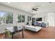 Bonus room with a white sofa, desk area, and large windows at 1112 Preserve Point Dr, Winter Park, FL 32789