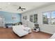 Bonus room with a white sofa, desk area, and large windows at 1112 Preserve Point Dr, Winter Park, FL 32789