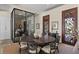 Refined dining area with wine storage, featuring an elegant round table, stylish chairs, and sophisticated decor at 1112 Preserve Point Dr, Winter Park, FL 32789