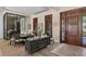Luxurious dining area showcasing ornate doors, stylish furnishings, and a modern sideboard at 1112 Preserve Point Dr, Winter Park, FL 32789