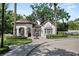 The entrance building is designed with a Spanish tile roof and lots of windows at 1112 Preserve Point Dr, Winter Park, FL 32789