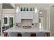 Modern kitchen with marble countertop island and stylish pendant lights at 1112 Preserve Point Dr, Winter Park, FL 32789