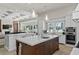 Bright, modern kitchen with double islands, white cabinetry, and stainless steel appliances at 1112 Preserve Point Dr, Winter Park, FL 32789