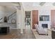 Elegant hallway leading to a bright living room with a fireplace at 1112 Preserve Point Dr, Winter Park, FL 32789