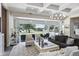 Bright living room opens to outdoor patio with lake views at 1112 Preserve Point Dr, Winter Park, FL 32789