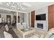 Open-concept living space with elegant furnishings and a fireplace at 1112 Preserve Point Dr, Winter Park, FL 32789