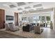 Spacious living room with large windows showcasing the backyard and water view at 1112 Preserve Point Dr, Winter Park, FL 32789
