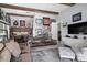 Bright living room featuring exposed beams, custom built-ins and sports memorabilia at 1112 Preserve Point Dr, Winter Park, FL 32789