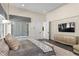 Bright main bedroom with decorative accents, outside view, and tv at 1112 Preserve Point Dr, Winter Park, FL 32789