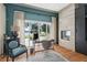 Well-lit home office with built-in fireplace and a view of the lake at 1112 Preserve Point Dr, Winter Park, FL 32789