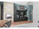 Home office featuring built-in storage, fireplace, and lake views at 1112 Preserve Point Dr, Winter Park, FL 32789