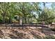 A playground with a bridge, climbing area, and slide is in a wooded area at 1112 Preserve Point Dr, Winter Park, FL 32789