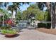 Beautiful pool with water view, surrounded by lush tropical landscaping and brick pavers at 1112 Preserve Point Dr, Winter Park, FL 32789