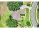 Aerial shot showcases the home's roof, landscaping, and proximity to a quiet residential street at 11602 Graces Way, Clermont, FL 34711