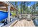 Dock features a boat lift, covered shelter, and outdoor seating overlooking the lake at 11602 Graces Way, Clermont, FL 34711