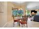 Cozy breakfast nook with ample natural light and views of the lush backyard at 11602 Graces Way, Clermont, FL 34711