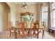 Formal dining room with elegant chandelier and views of the front yard at 11602 Graces Way, Clermont, FL 34711